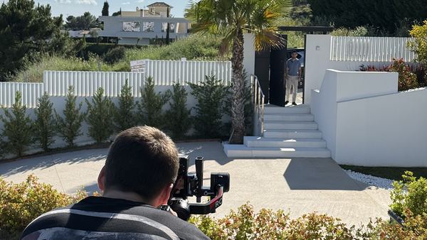 Filming a gimbal shot on a villa driveway