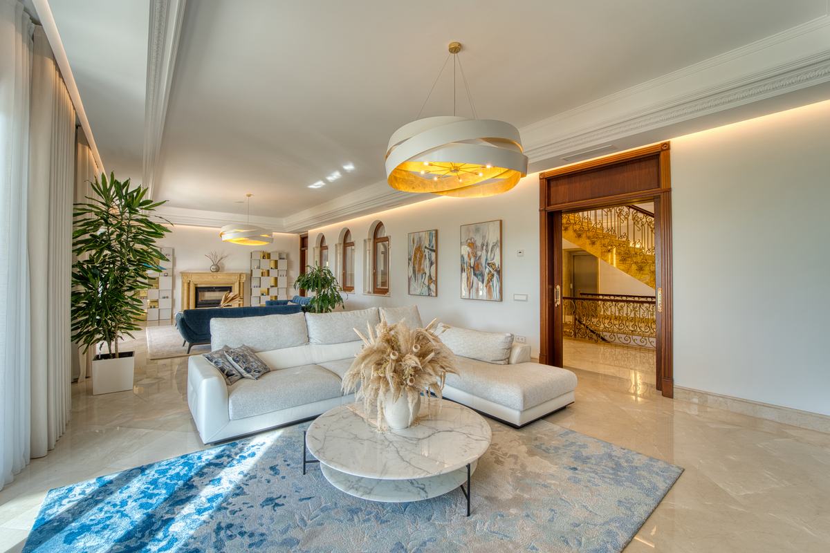 Classic living room with chandelier and marble floor